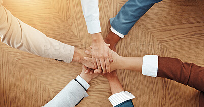 Buy stock photo Above, desk and hands of business people in office for solidarity, cooperation and partnership. Professional team, corporate and workers with stack for collaboration, support and coworking synergy