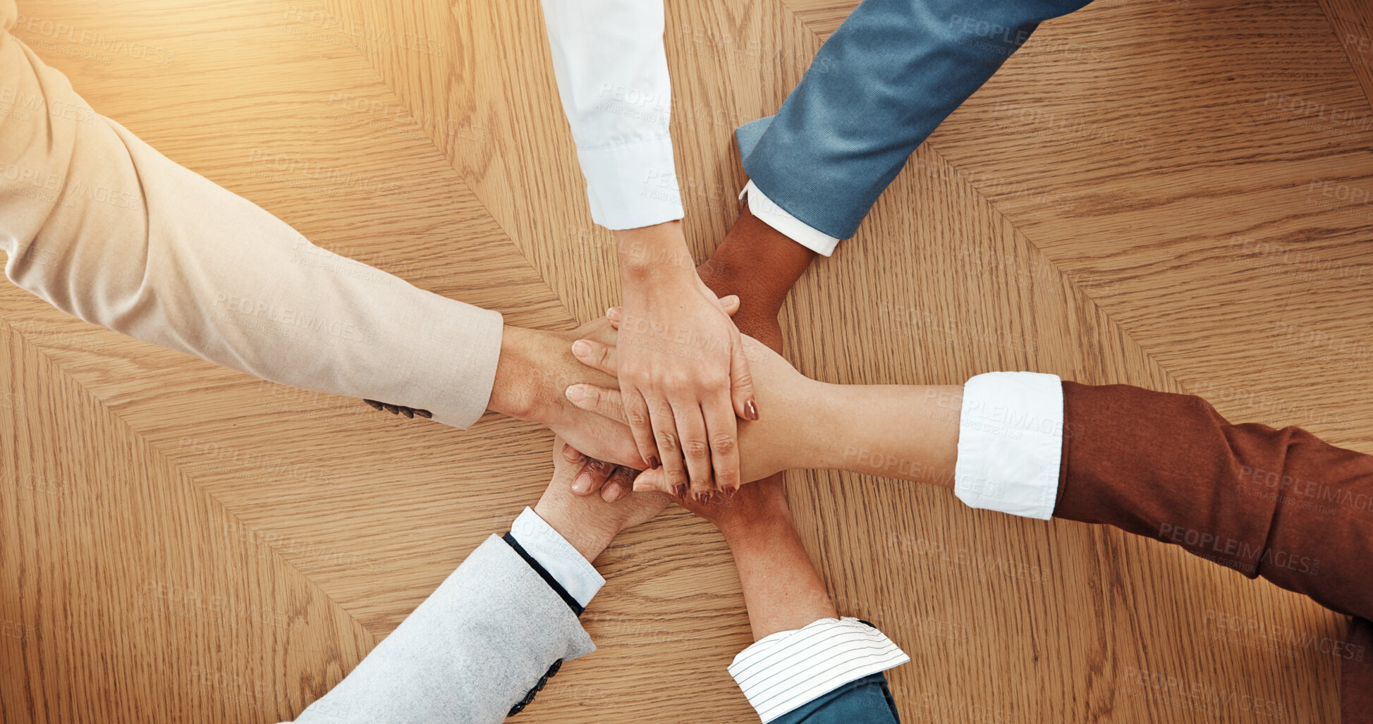 Buy stock photo Above, desk and hands of business people in office for solidarity, cooperation and partnership. Professional team, corporate and workers with stack for collaboration, support and coworking synergy
