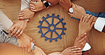Business people, hands or unity with cog for team building or problem solving together above. Top view, group or employees with wheel mesh or gear in circle for critical thinking or mission on table