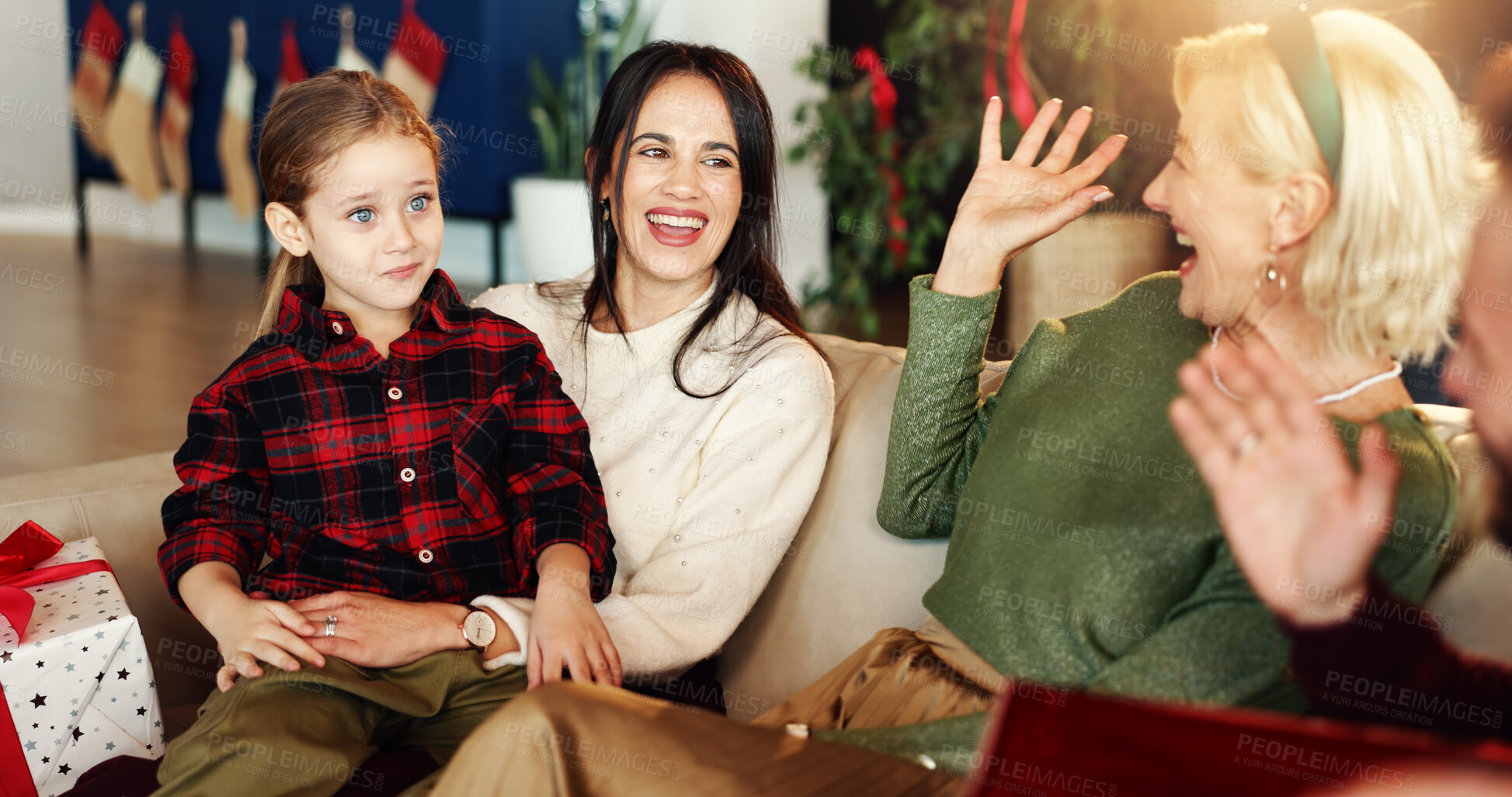 Buy stock photo Grandma, mom and child in home for Christmas, festive season and bonding on holiday. Happy family, laugh and girl on sofa with funny joke, care and senior woman to relax for tradition, kid or love