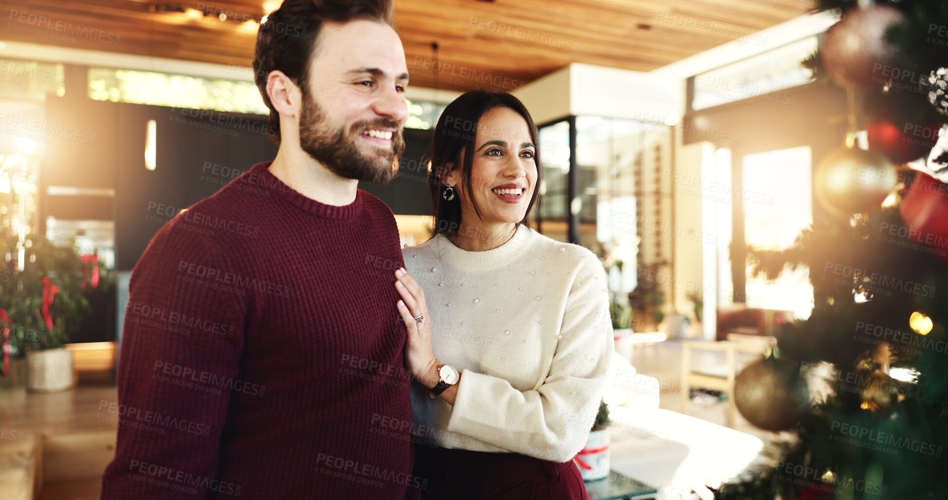 Buy stock photo Christmas, couple and smile for celebration, home and romance in festive season, decoration or tree. Happy, man and bonding with woman on holiday, December or love on weekend in house or relationship