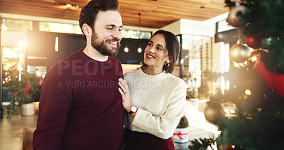 Buy stock photo Christmas, couple and smile for tree, home and romance in festive season, decoration or celebration. Happy, man and bonding with woman on holiday, December or love on weekend in house or relationship