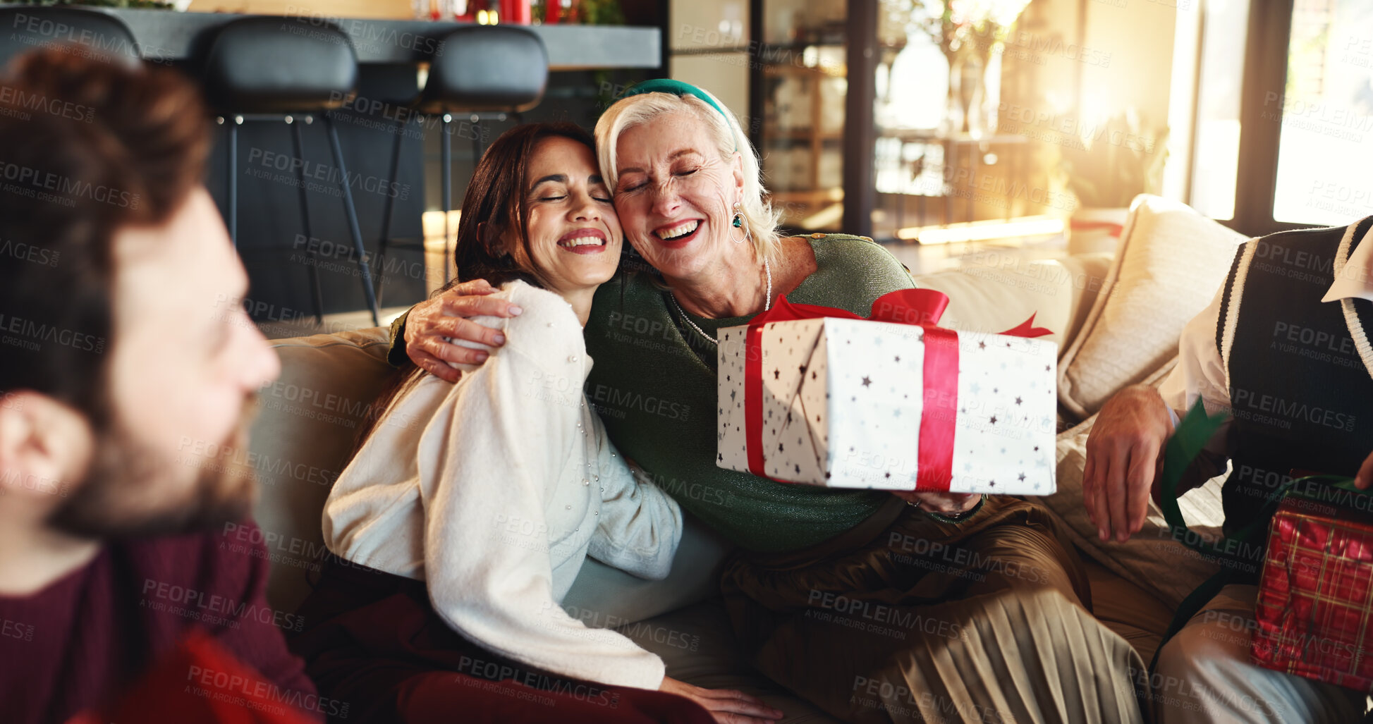 Buy stock photo Hug, Christmas gift and woman with senior parent for vacation, bonding and excited. December, holiday or festive surprise with family, present and celebration with smile and social gathering in home