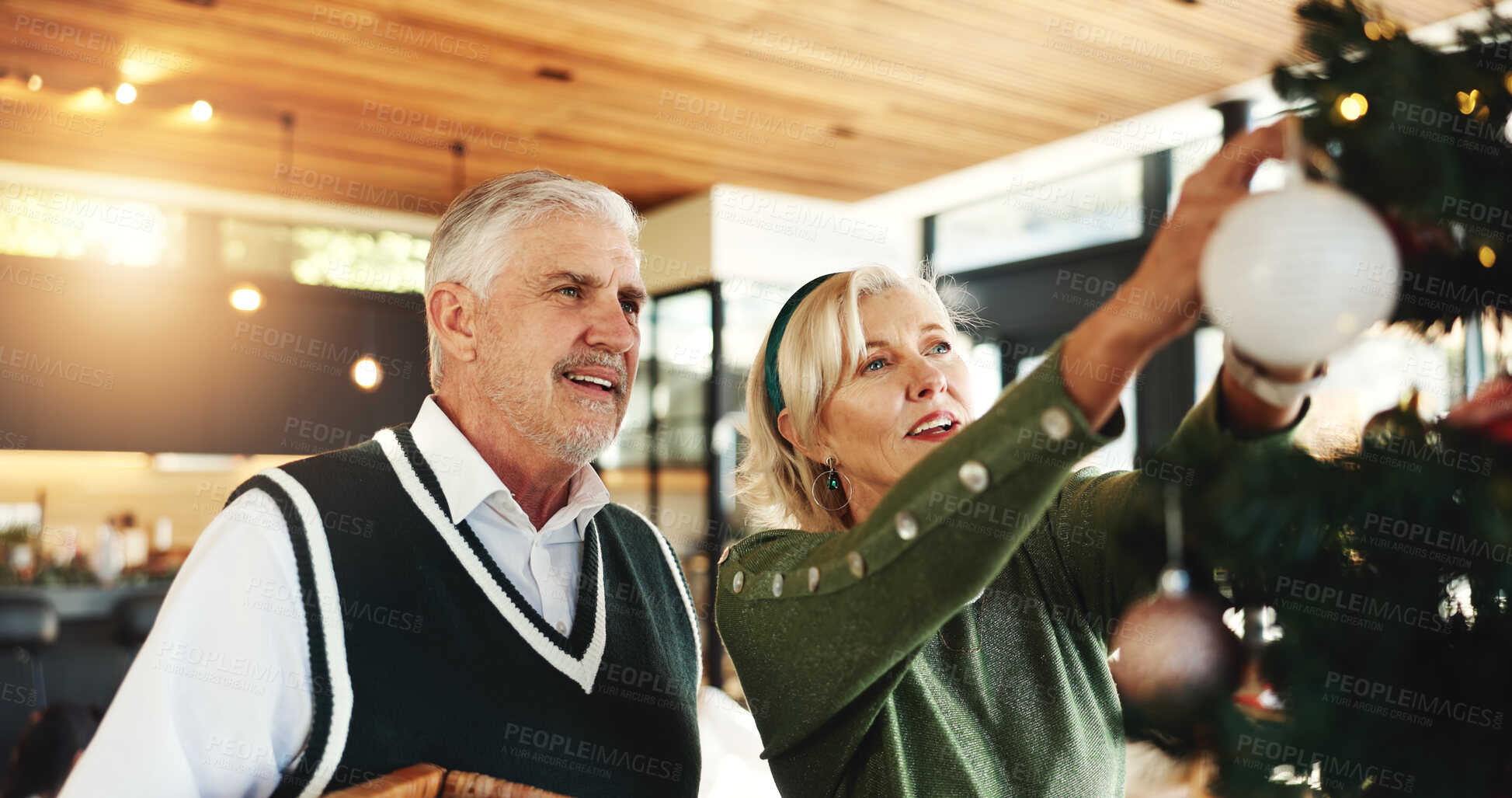 Buy stock photo Christmas, tree or senior couple with ornament for festive decoration, tradition or christian home. Hang, ball or elderly woman with trinket or lights for holiday, creativity or party on vacation