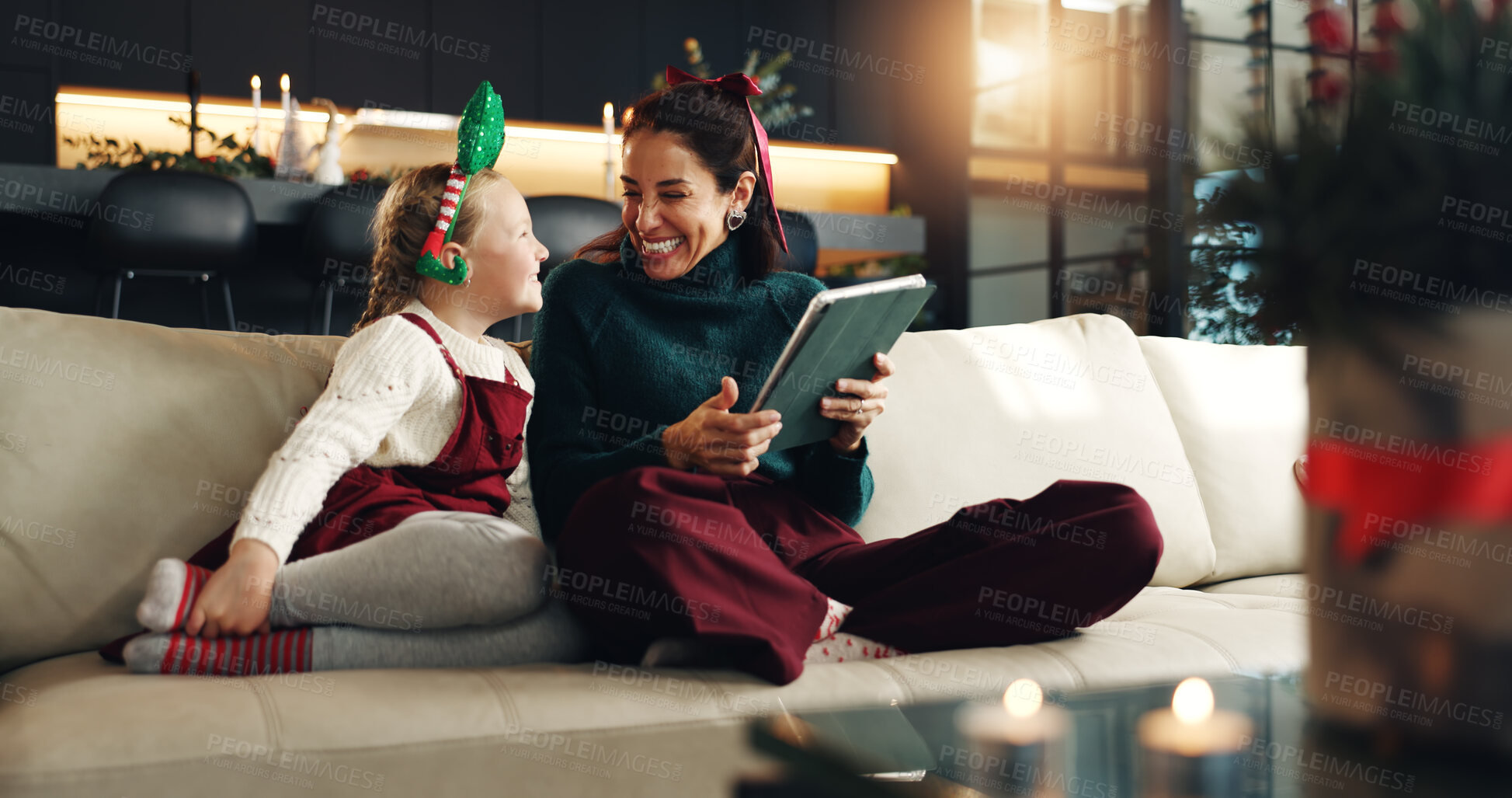 Buy stock photo Christmas, happy mom and kid with tablet in home for holiday, love and care. Xmas, parent and girl child with tech in living room for festive season, relax and family bonding together with daughter