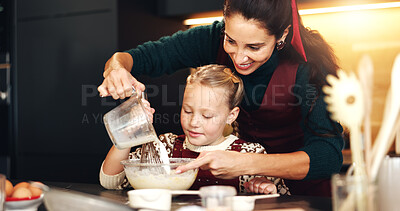 Buy stock photo Milk, mother and child baking for learning, help and bonding in home kitchen. Happy parent, kid and cooking with flour, pour dairy and teaching recipe to girl with ingredients for dessert with family