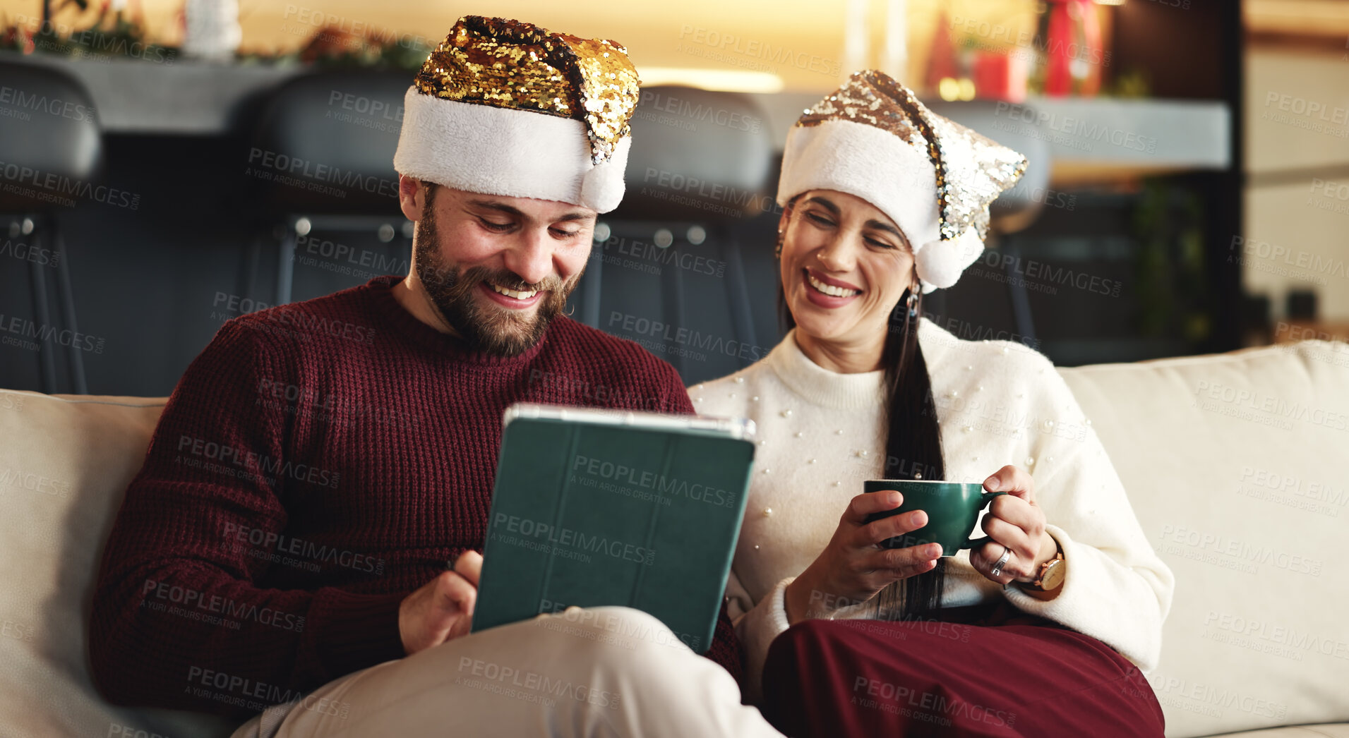 Buy stock photo Xmas, coffee or couple on couch, tablet or bonding together with social media, love or app. Home, Christmas or man with woman, holiday season or eggnog with online entertainment, festive or tradition