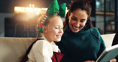 Buy stock photo Christmas, mother and happy child with tablet on sofa for festive meme, bonding or family laugh. Xmas, daughter and mom with tech in home for funny game, video or scroll app for vacation or holiday