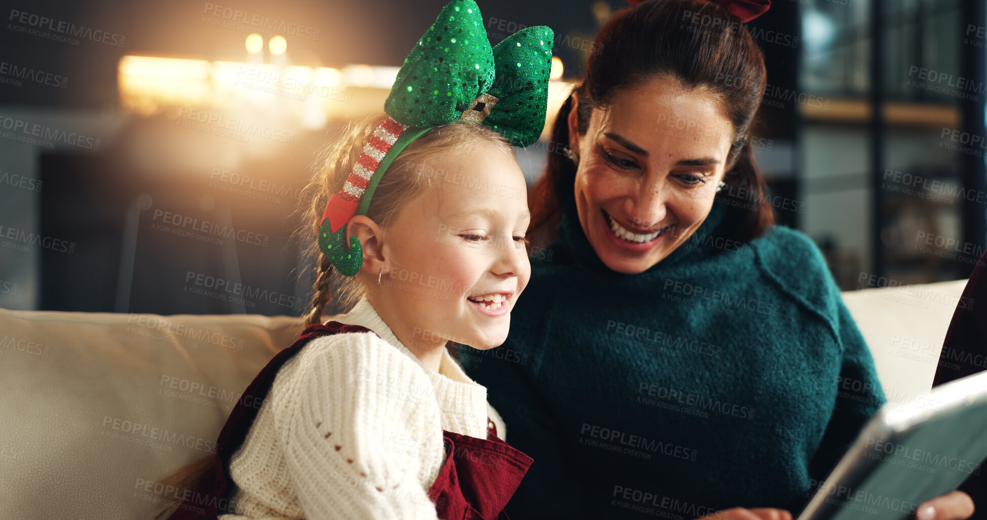 Buy stock photo Christmas, mother and happy child with tablet on sofa for festive meme, bonding or family laugh. Xmas, daughter and mom with tech in home for funny game, video or scroll app for vacation or holiday