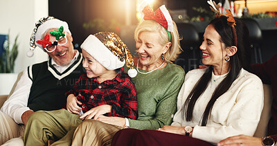 Buy stock photo Grandparents, parents and kid on sofa for Christmas, festive season and bonding on holiday. Happy family, home and girl with mom, dad and senior people laugh for tradition, celebration and xmas decor
