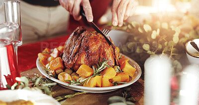 Buy stock photo Roast, food and hands of person for holiday celebration with knife for cutting, host or thanksgiving. Chicken, vegetables and dining table in home for tradition, festive and turkey feast in closeup