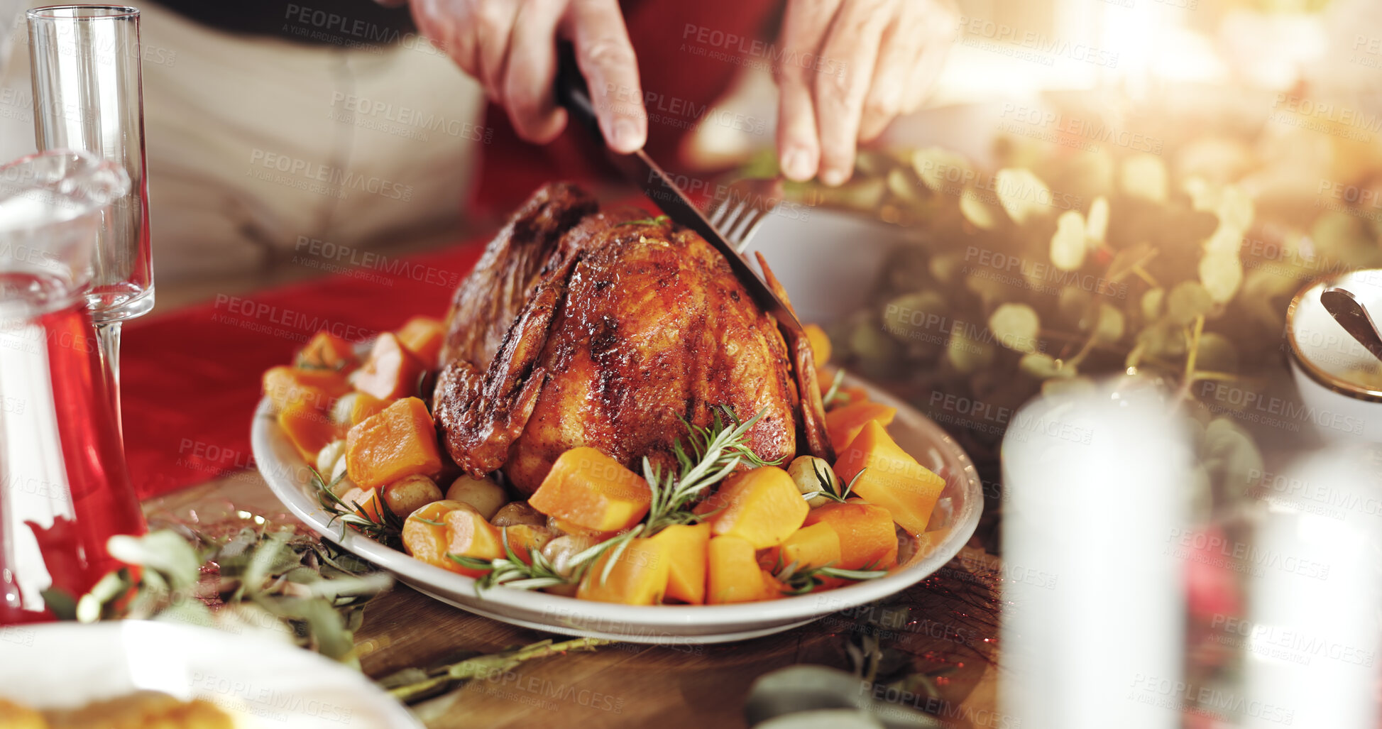 Buy stock photo Roast, food and hands of person for holiday celebration with knife for cutting, host or thanksgiving. Chicken, vegetables and dining table in home for tradition, festive and turkey feast in closeup