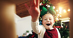 Christmas, surprise and happy child with gift box in low angle for festive celebration. POV, xmas and excited girl open present with shock, wow and unboxing package with portrait on holiday below