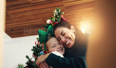 Buy stock photo Christmas, mother and happy girl with hug for festive season, bonding and family smile. Xmas portrait, daughter and mom with embrace in home for gift POV, love and holiday or child vacation memory