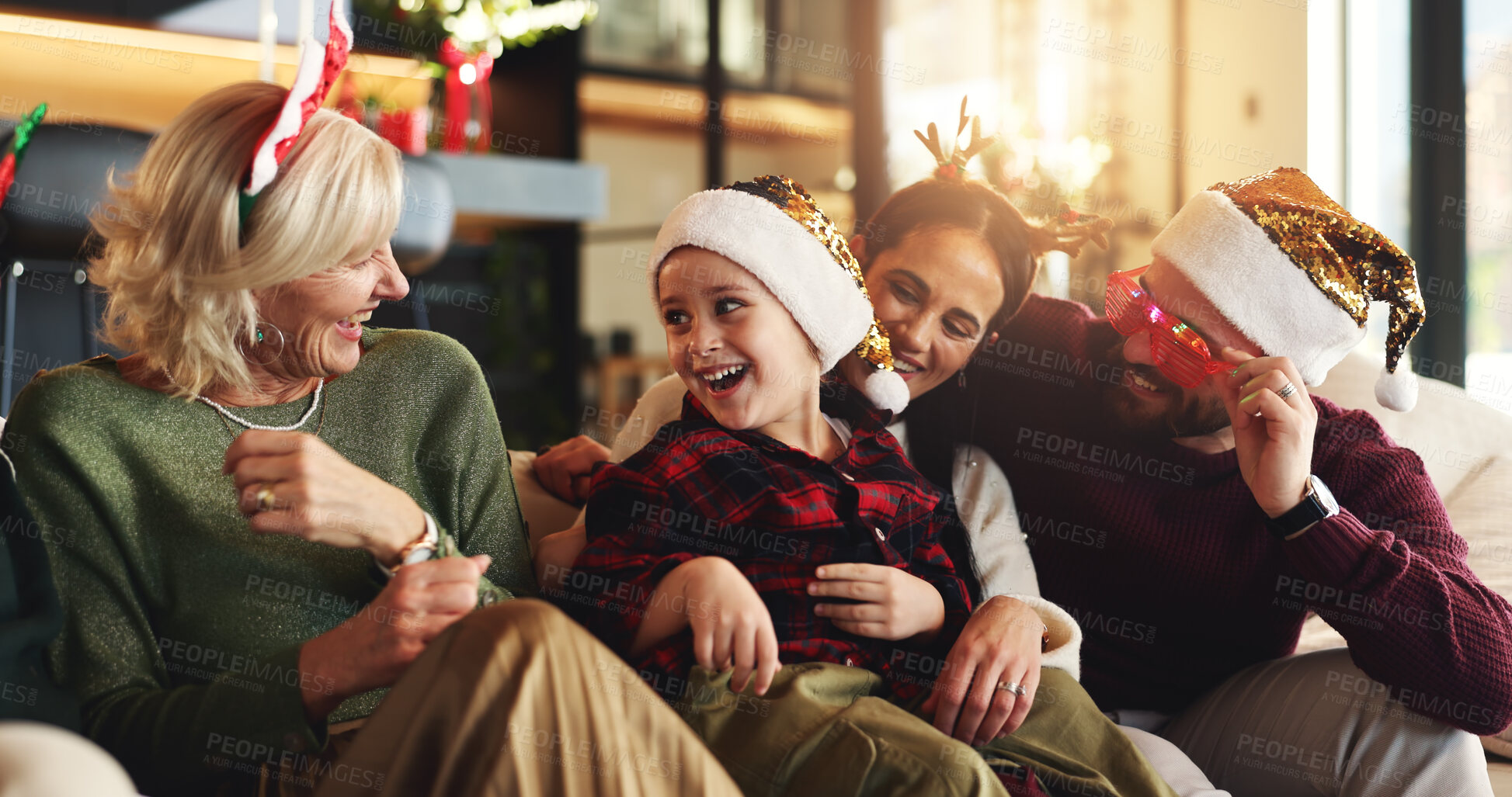 Buy stock photo Family, generations and child on sofa for Christmas, festive season and bonding on holiday. Happy, home and girl with mom, dad and grandmother laugh for tradition, celebration and xmas decoration