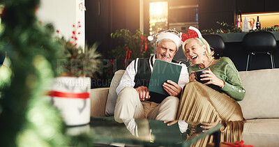 Buy stock photo Christmas, coffee and old couple on sofa, tablet or bonding together with social media, festive or app. Home, Xmas or man with woman, tradition or eggnog with online entertainment, love or holiday