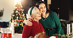 Hug, Christmas and woman with senior parent for vacation, bonding and excited. December, holiday or festive season with family, mature mother and celebration with smile and social gathering in home