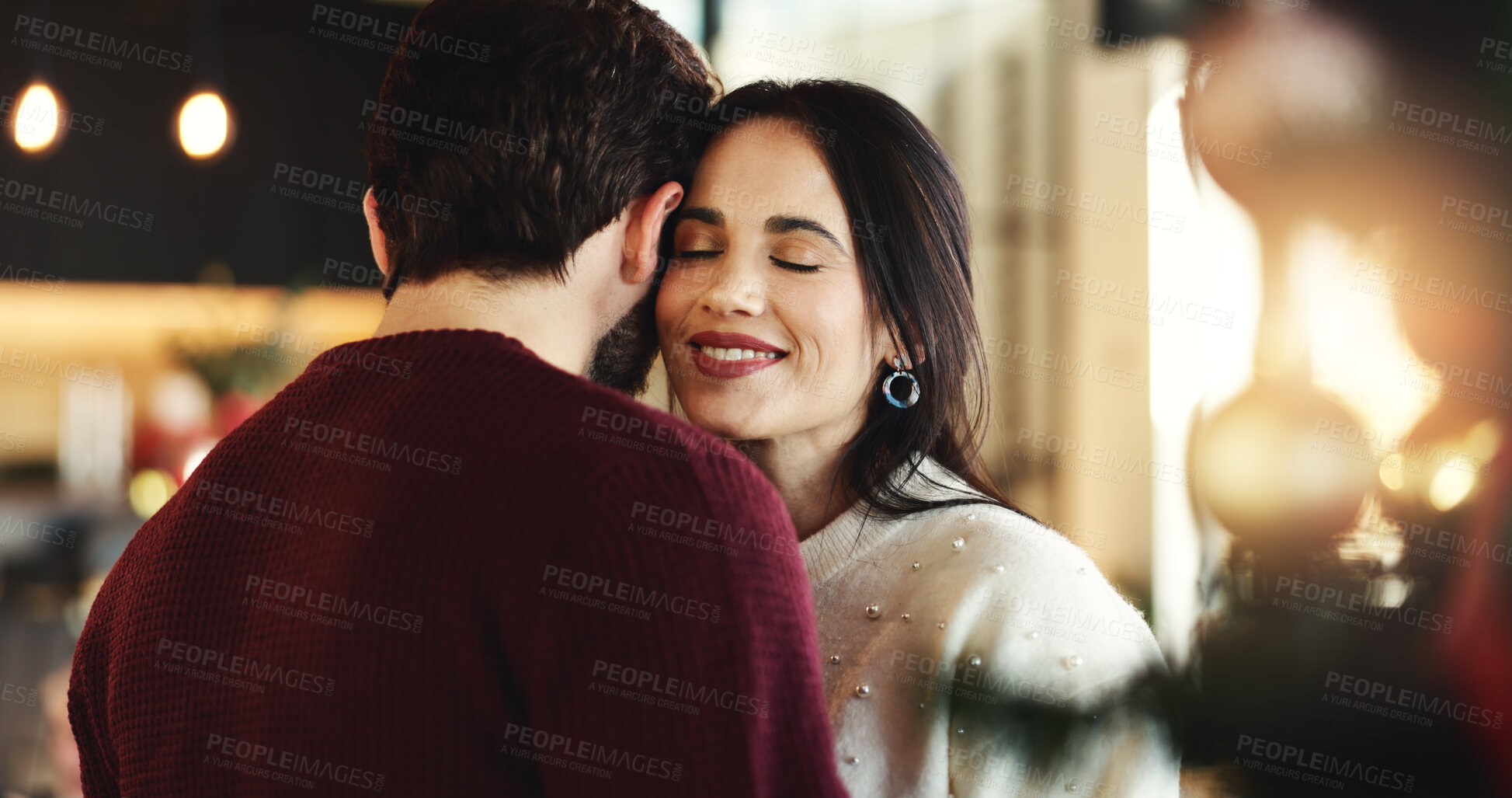 Buy stock photo Dancing, couple and embrace for Christmas, home or romance in festive season, smile and celebration. Happy, woman and bonding with man on holiday, December or love on weekend in house or relationship