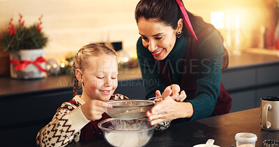 Buy stock photo Mom, girl and flour with sifting at Christmas with cooking, teaching and ingredients for cookies in home. People, mother and daughter in kitchen, learning and sieve for baking at xmas in family house