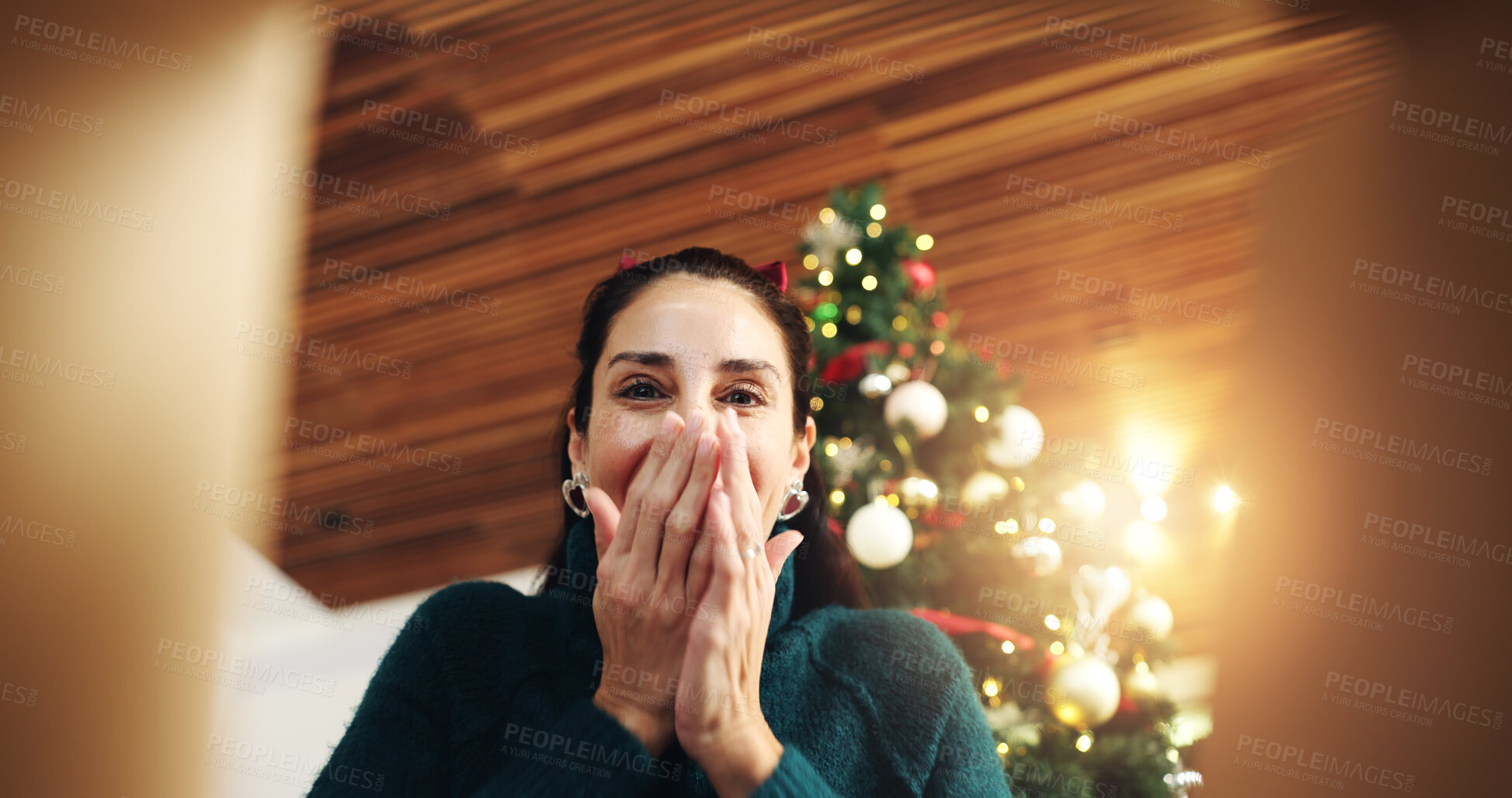 Buy stock photo Christmas, surprise and happy woman with gift box in low angle for festive celebration. POV, xmas and excited person open present with shock, wow and package with portrait on holiday at home below
