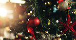 Christmas, tree and bauble with decor for festive holiday, december or celebration in home. Closeup, object or decorations with ornaments hanging for christian tradition, santa or new year in house