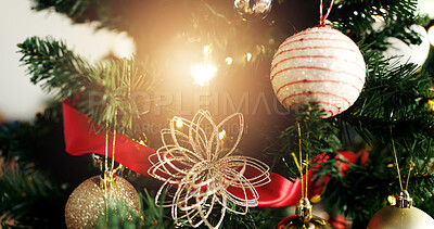 Buy stock photo Christmas, tree and bauble with light for festive holiday, December or celebration in home. Closeup, object or decorations with ornaments hanging for christian tradition, Santa theme or new year
