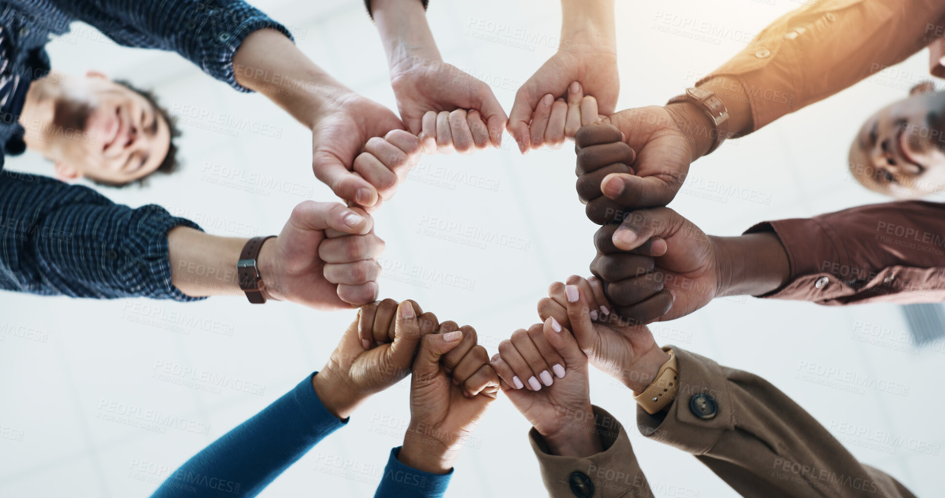 Buy stock photo Below, business and people with fist together for team building, solidarity and trust with motivation. Staff, scrum and huddle in circle with collaboration, employees unity and synergy for connection