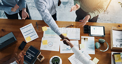 Buy stock photo Shaking hands, finance documents and business people in office for deal, negotiation or partnership. Handshake, top view and financial advisors with client for investment meeting in workplace.