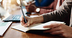 Business person, hands and writing with diary for reminder, schedule or taking notes in office. Closeup, employee or event planner with pen, book or ideas for planning, agenda or tasks in workplace