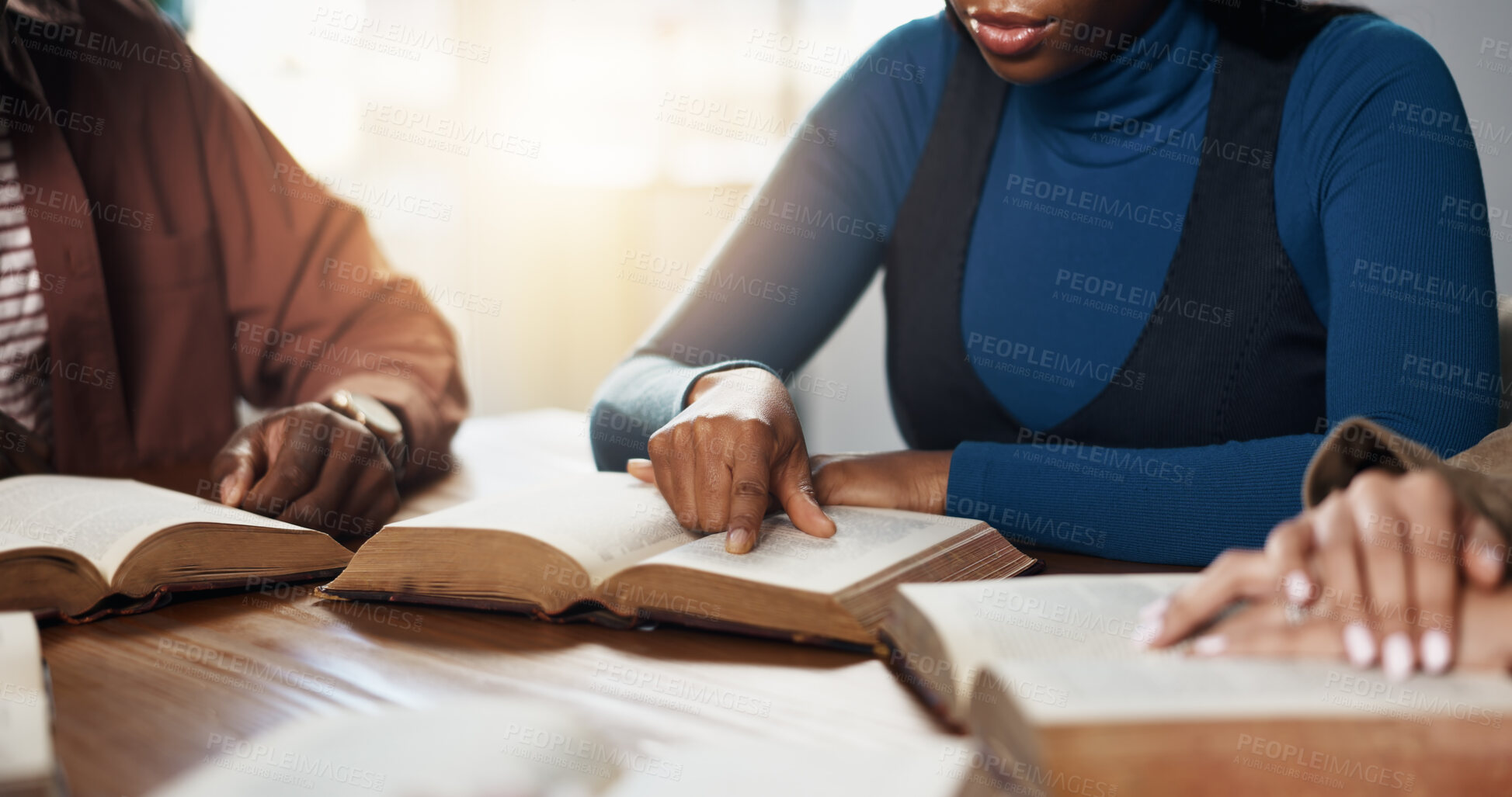 Buy stock photo Hands, reading and people for Bible study, worship or group learning gospel for religion. Faith, Christianity and knowledge about God, scripture or theology text for guidance with spiritual growth