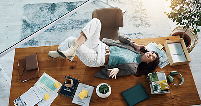 Buy stock photo Above, phone call and relax with woman on table in office for business, break or conversation. Communication, contact and smile with happy social media manager lying on desk at work for discussion