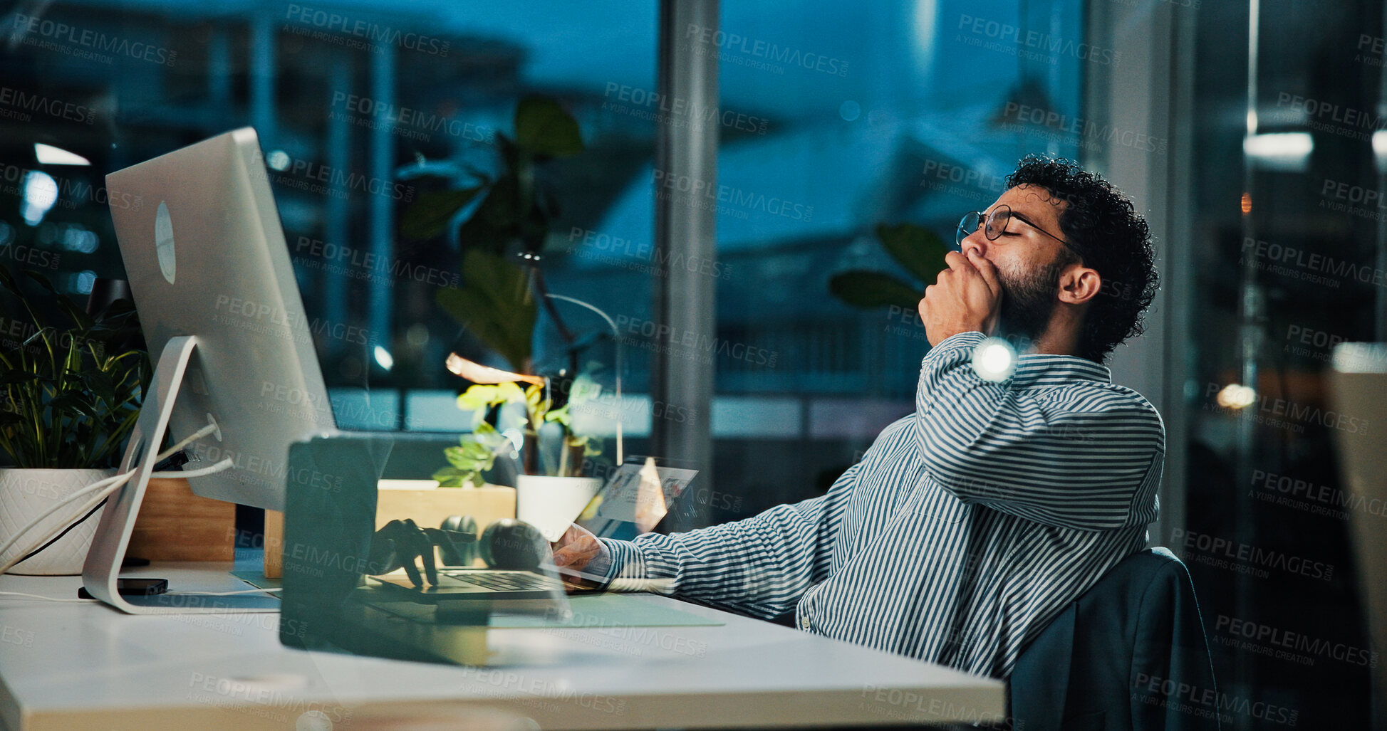 Buy stock photo Tired, businessman and night with yawn on computer for project deadline or exhausted in office. Man, employee or workaholic working late with technology for fatigue, insomnia or overtime in workplace