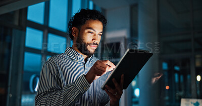 Buy stock photo Tablet, stock market and businessman in office at night analyzing finance report by window for trading. Digital technology, professional and male financial analyst with online research for investment