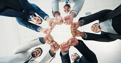Buy stock photo Fist bump, unity and hands of business people in office for solidarity, circle or partnership. Teamwork, collaboration and group of corporate employees with support, synergy or motivation from below.
