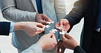 Business, teamwork and hands of people with puzzle piece for work efficiency, synergy and solution. Corporate, collaboration and employees with jigsaw in office for staff cooperation and integration