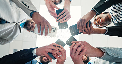 Buy stock photo Research, colleagues and group with smartphone, office and networking for project on website or app. Browsing, low angle and people with mobile for brand awareness, together and tech for advertising