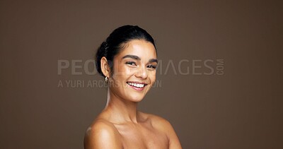 Buy stock photo Portrait, aesthetic and skincare with happy woman in studio for beauty, natural glow or shine. Face, smile and female model with cosmetics for dermatology, self care or space on brown background