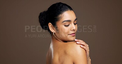 Buy stock photo Beauty, woman and shoulder in studio for natural skincare, dermatology or touch on brown background. Healthy glow, wellness and antiaging with space, clean skin or self care with smooth texture