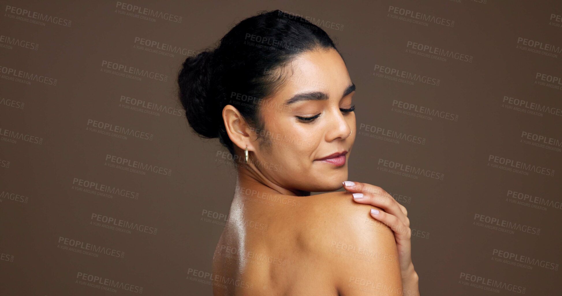 Buy stock photo Beauty, woman and shoulder in studio for natural skincare, dermatology or touch on brown background. Healthy glow, wellness and antiaging with space, clean skin or self care with smooth texture