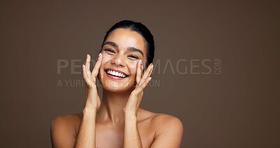 Buy stock photo Beauty, woman and happy with face cream in studio for collagen treatment, hydration and self care. Mockup, girl and cosmetics application on brown background for skin glow, anti aging and dermatology