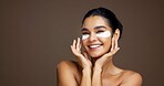 Happy woman, portrait or beauty with eye patches in studio for collagen on a brown background. Face, female person or model with smile or mask for anti aging treatment, skincare or vitamin c on space