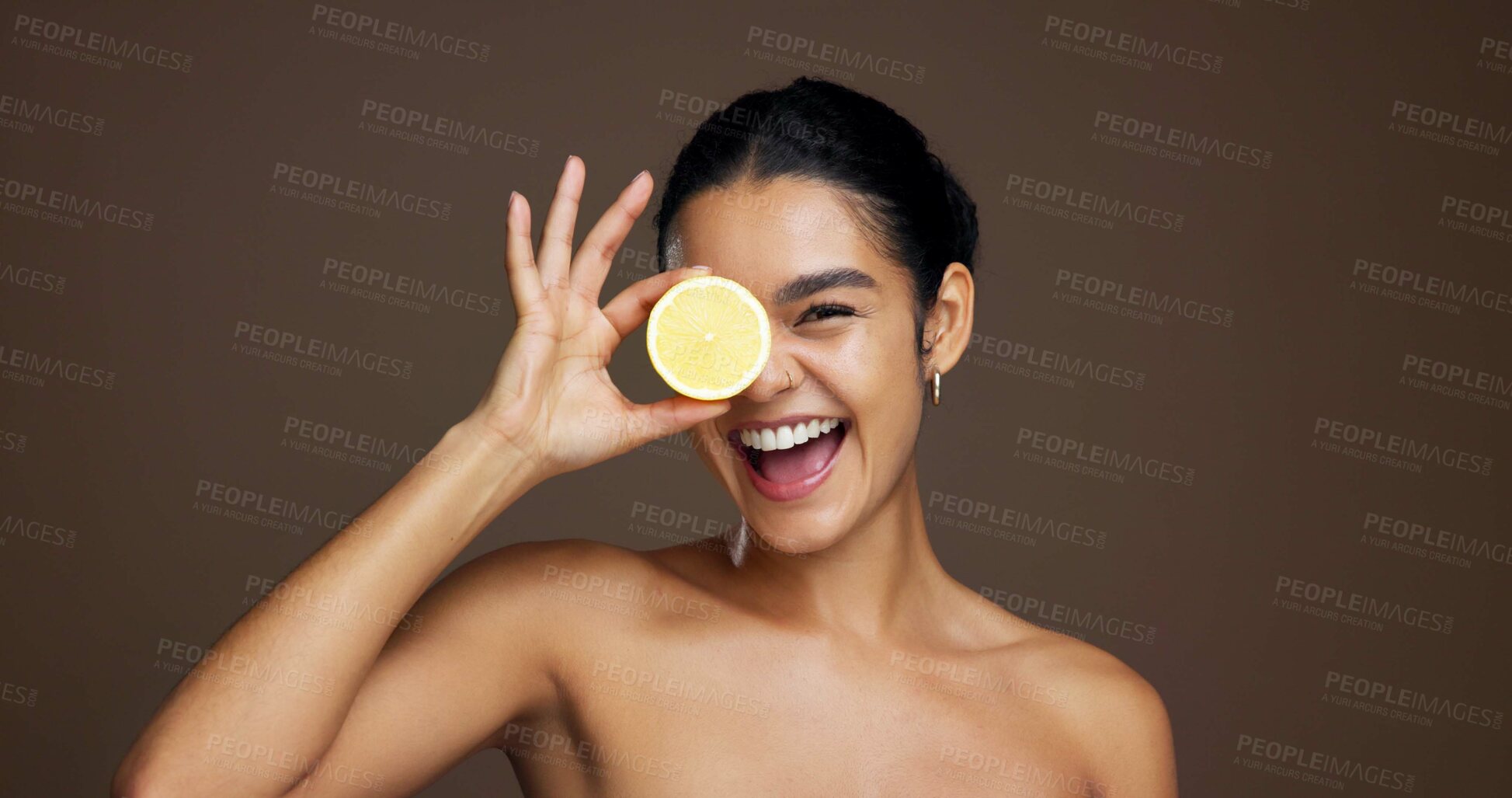 Buy stock photo Happy woman, portrait or lemon with skincare for vitamin C or detox on a brown studio background. Face, female person or model with smile or natural organic fruit for citrus acid, health and collagen