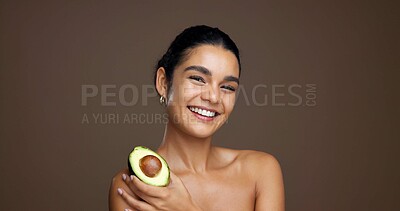 Buy stock photo Beauty, woman and portrait with avocado in studio for natural skincare, dermatology or omega 3 on background. Healthy glow, green fruit and sustainable antiaging with clean skin or self care space