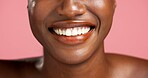 Beauty, cosmetics and teeth of black woman in studio for dermatology, skin hydration or vitamin C. Smile, skincare and wellness with model person isolated on pink background for facial aesthetic