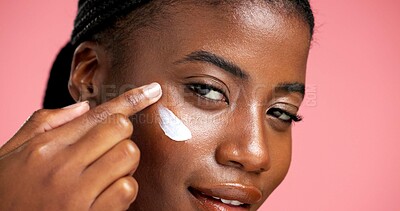 Buy stock photo Portrait, hydration and black woman with cream, skincare and smile for healthy skin and dermatology. Happy, person and cosmetics for facial treatment, studio background and lotion for beauty or shine
