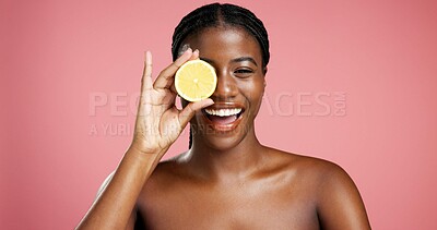 Buy stock photo Portrait, black woman and lemon for beauty in studio for vitamin c, brighten skin and natural detox. Female person, citrus fruit and organic benefits, skincare and exfoliate shine on pink background
