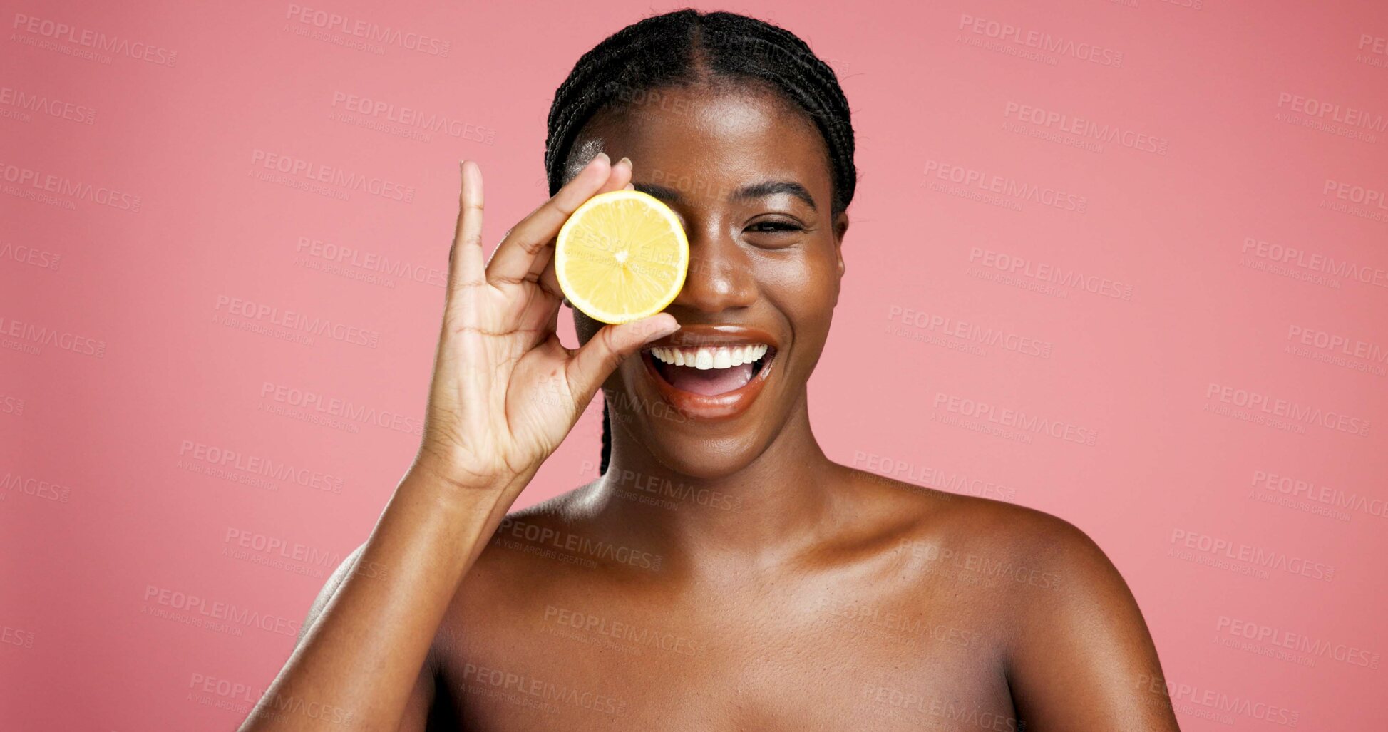 Buy stock photo Portrait, black woman and lemon for beauty in studio for vitamin c, brighten skin and natural detox. Female person, citrus fruit and organic benefits, skincare and exfoliate shine on pink background
