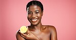 Portrait, African woman and lemon for skincare in studio for vitamin c, brighten skin and natural detox. Female person, citrus fruit and organic benefits, beauty and exfoliate glow on pink background