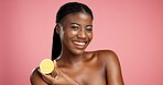 Portrait, black woman and lemon for skincare in studio for vitamin c, brighten skin and natural detox. Female person, citrus fruit and organic benefits, beauty and exfoliate shine on pink background
