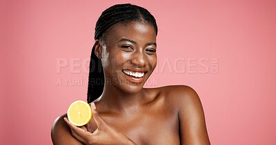 Buy stock photo Portrait, black woman and lemon for skincare in studio for vitamin c, brighten skin and natural detox. Female person, citrus fruit and organic benefits, beauty and exfoliate shine on pink background
